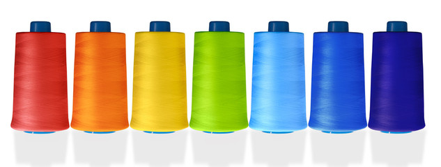 multicolored thread reels on a white background