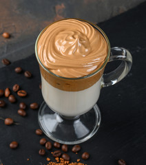 Glass cup with Dalgona frothy coffee trend korean drink latte espresso with coffee foam
