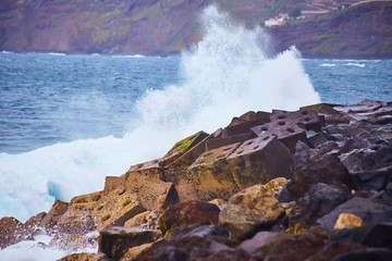 Tenerife, Canary islands, Spain - view of the beautiful Atlantic ocean coast with volcanic rocks and stones