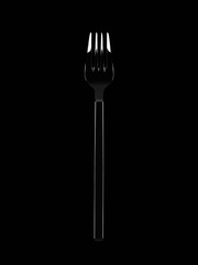 Stainless fork on black background with copy space.