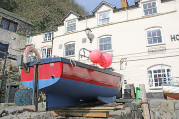 Fototapeta na wymiar Boat on Clovelly harbour wall, Devon