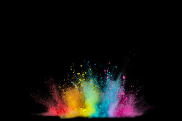Obraz na płótnie Canvas Explosion of colored powder isolated on black background. Abstract colored background