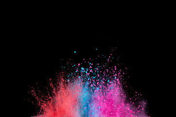 Explosion of colored powder isolated on black background. Abstract colored background