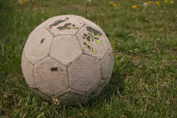 old ball on the grass
