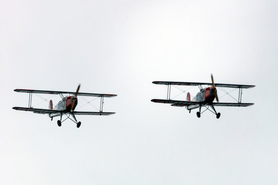 Oslo, Norway - 05.05.2020: Two bucker jungmann propeller planes mid air during airshow.