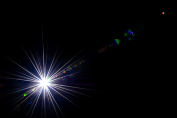 Abstracts lights, Sun shine flash lens effect or star spot glow light on black background. Gleams...