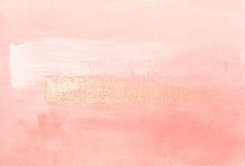 Handmade modern subtle pink abstract painted background texture with shiny metallic golden brush...