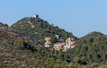 Fototapeta na wymiar Small town Lastovo with a fortress on the hill on island Lastovo in Dalmatia, Croatia