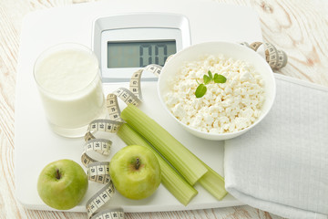 Healthy food concept. Slimming. Scales, measuring tape and healthy meal. Control of weight during the isolation period