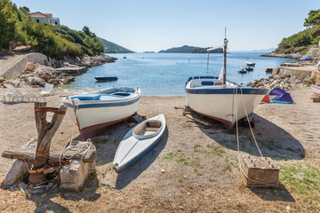 Small tranquil bay Zaglav with fishing boats on island Korcula in Dalmatia, Croatia