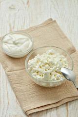 Glass bowls with fresh village cottage cheese and yogurt.  Healthy food.  Dairy product.