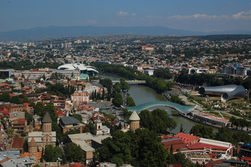 Obraz premium Traditional Georgian architecture and panoramic view of Tbilisi city, old town and modern architecture. Tbilisi the capital of Georgia