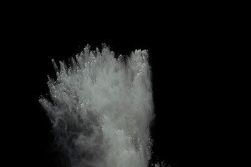 Obraz na płótnie Canvas White powder explosion isolated on black background.