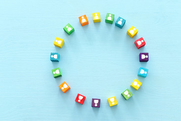 image of colorful blocks with people icons over wooden table ,human resources and management concept