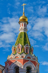 Fototapeta na wymiar Domes of the temple against a cloudy sky in Moscow