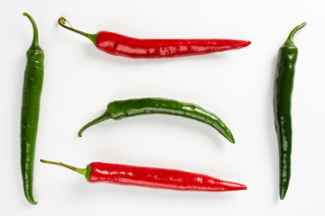 A group of red and green hot peppers isolated on a white background