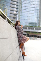 smile in modern city with flower dress