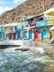Fototapeta na wymiar Klima Fishing Village with bright coloured wooden doors - Milos Island - Greece