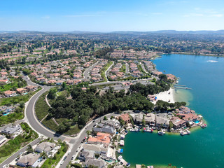 Naklejka premium Aerial view of Lake Mission Viejo, with recreational facilities, surrounded by private residential and condominium communities. Orange County, California, USA