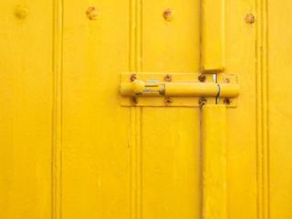 Texture Yellow Paint on Wooden at Klima Fishing Village - Milos Island, Greece
