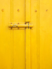 Texture Yellow Paint on Wooden at Klima Fishing Village - Milos Island, Greece