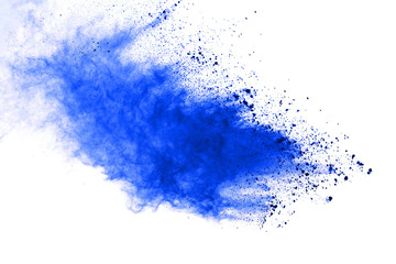 Abstract blue powder explosion on white background. Closeup of blue dust particles splash isolated...