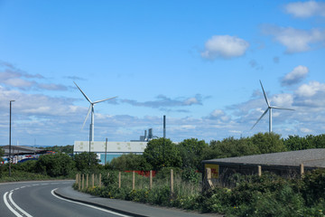 Windmill turbine on the field in UK with blue sky © MF1688