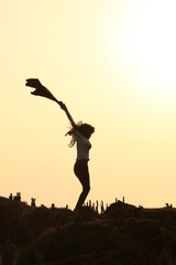 silhouette of a girl jumping