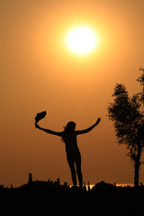 silhouette of a girl in sunset