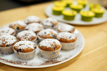 Plate with freshly baked sweet muffins. Sweet pastries, recipes, cooking