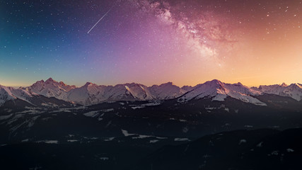 Naklejka premium Snowy rocky mountain with a beautiful starry night, space fort text