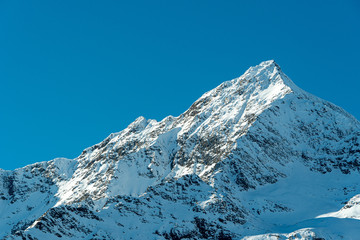 Fototapeta na wymiar snowy peak of a mountain