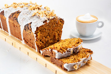 Carrot cake dessert accompanied by a cup of coffee