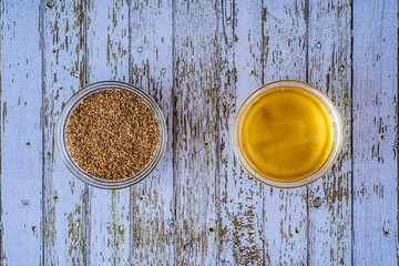 Walnut shell scrub and honey in a glass bowl. Natural organic ingredients. Home skin care for cellulite. Concept of skin care. Home Spa. Top view on a lilac wooden board.