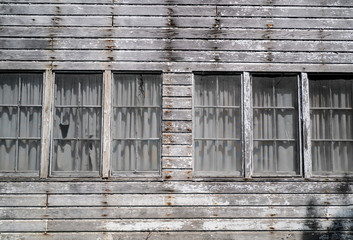 Obraz na płótnie Canvas Weathered and abandoned warehouse building