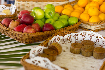 Cakes and fruits on the table.