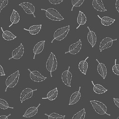 Seamless pattern of white leaves on gray background. Black white sketch. Hand drawn digital paper. Doodle. Blackboard. For logo, wallpaper, fabric, packing, wrapping, logo