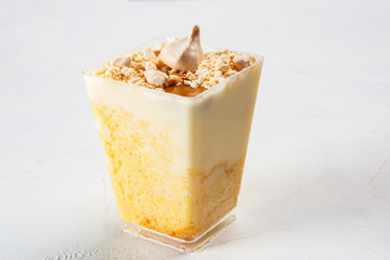 Cheesecake dessert served in a small plastic cup