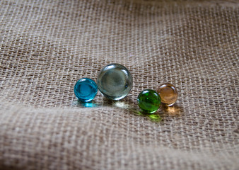 Colored glass balls on burlap