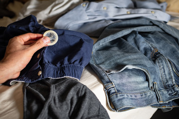 Condom in Hand and Men's Underwear. Concept: Gay Sex.