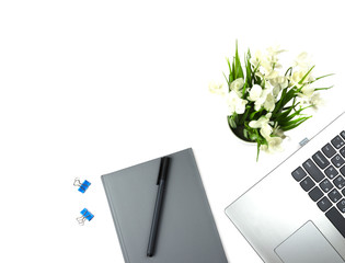 Flat lay, top view office table desk. Workspace with keyboard, office supplies, pen, potted plants, and notebook on white background