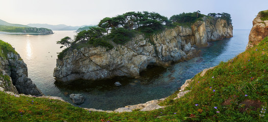High cliffs in the ocean. Rocky islands and rocks in Orlik Bay in the Sea of Japan. Far East. © Anna