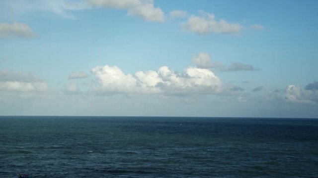 Beautiful horizon view of the ocean and blue sky with clouds in Brazil
