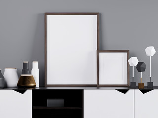 3d render of a fragment of a gray wall and set decorative. Large two frames for photos or paintings. Black and white space with golden accents and dark wood. Close up Scandinavian decor