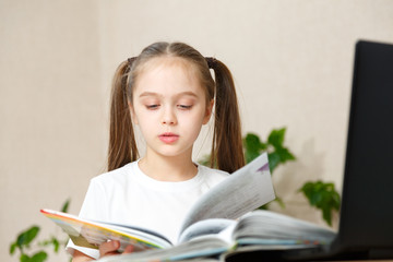 Little Girl in a White t-shirt Does Her Homework. Bright Room With Daylight, Independent Girl, Education