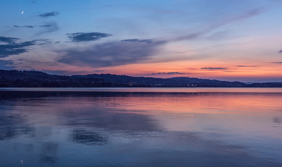 Fototapeta na wymiar staggering sunset shot of lake sempach in summer canton lucerne