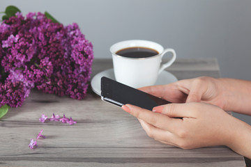  woman hand phone with coffee