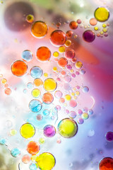 Planet Looking Bubbles of Coloured Water on Oil Fantasy Background