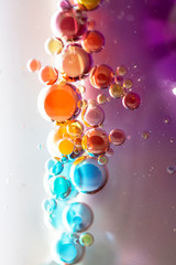Planet Looking Bubbles of Coloured Water on Oil Fantasy Background