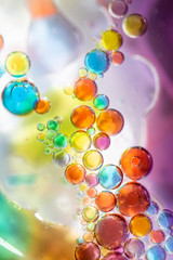 Planet Looking Bubbles of Coloured Water on Oil Fantasy Background